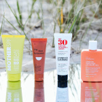 Four bottles of sunscreen at the beach