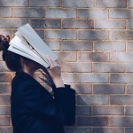 girl with book on her head